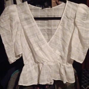 Nwt cute white boho like top with an elastic waist and very pretty silver thread